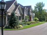 Front of house in Pepper Pike Ohio showing landscape design plantings in bed. title=